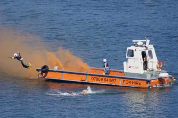 27 August 2022 - 13:42:50
Dart RNLI had a major demo routine. The volunteer victims played their roles with gusto. Here's a couple of them abandoning their ship 'on fire'
 ----------------- 
Dart RNLI Regatta demonstration